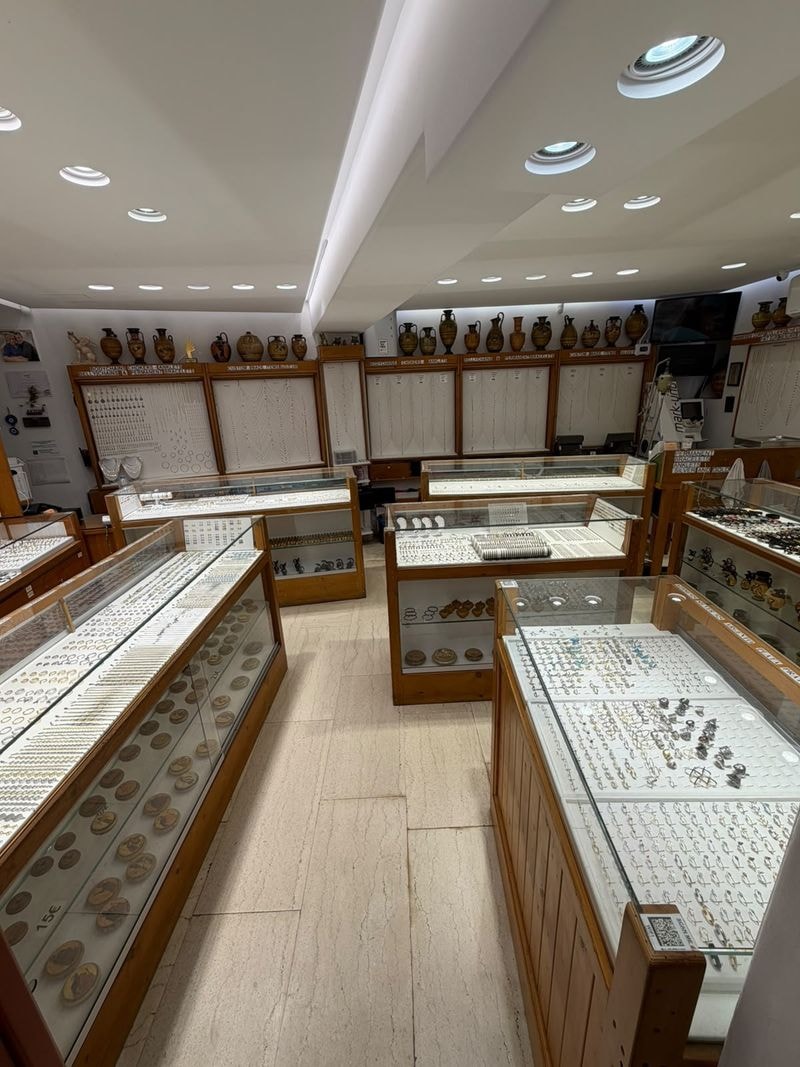 Inside the shop: bracelets, necklaces and rings in the wooden display cases